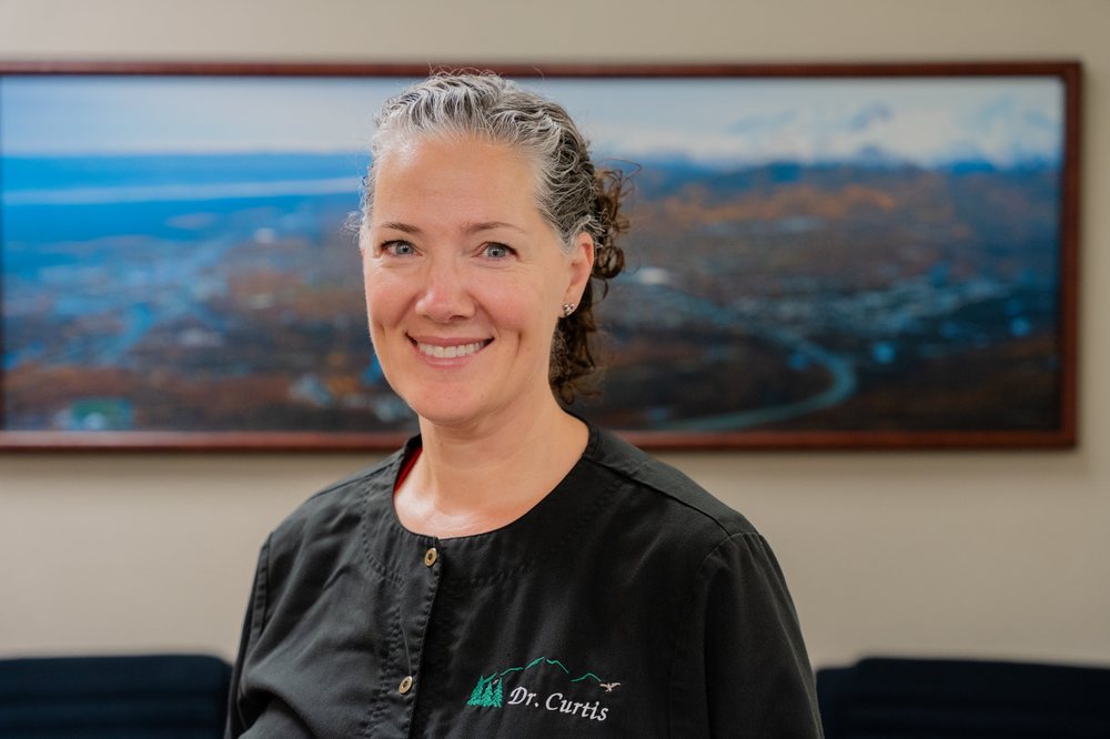 Dr. Caroline Curtis smiling in an exam room at Eagle View Family Dental.