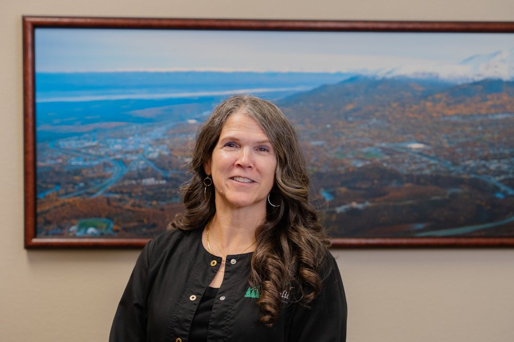Front Desk Manager Julie Blackley, smiling in the Eagle View Family Dental office.